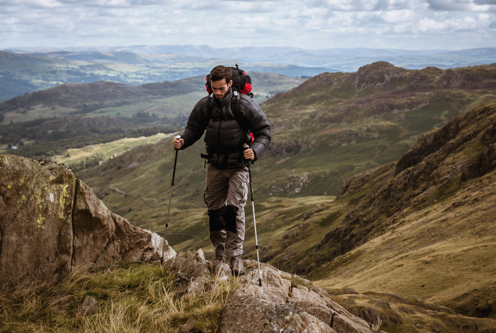 Young Male Hiker Moving Up Mountain, The Lake District, Cumbria, Uk